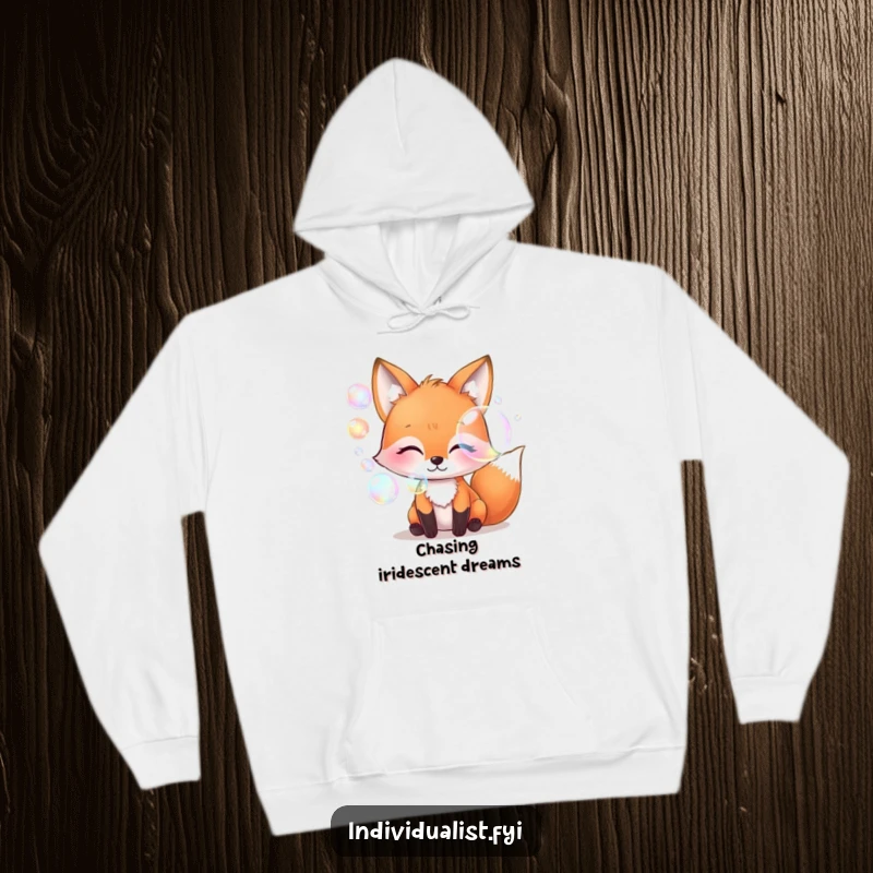 Funny whimsical fox blowing iridescent bubbles, cozy hoodie, magical art, warm apparel, unique and funny gift for all ages.