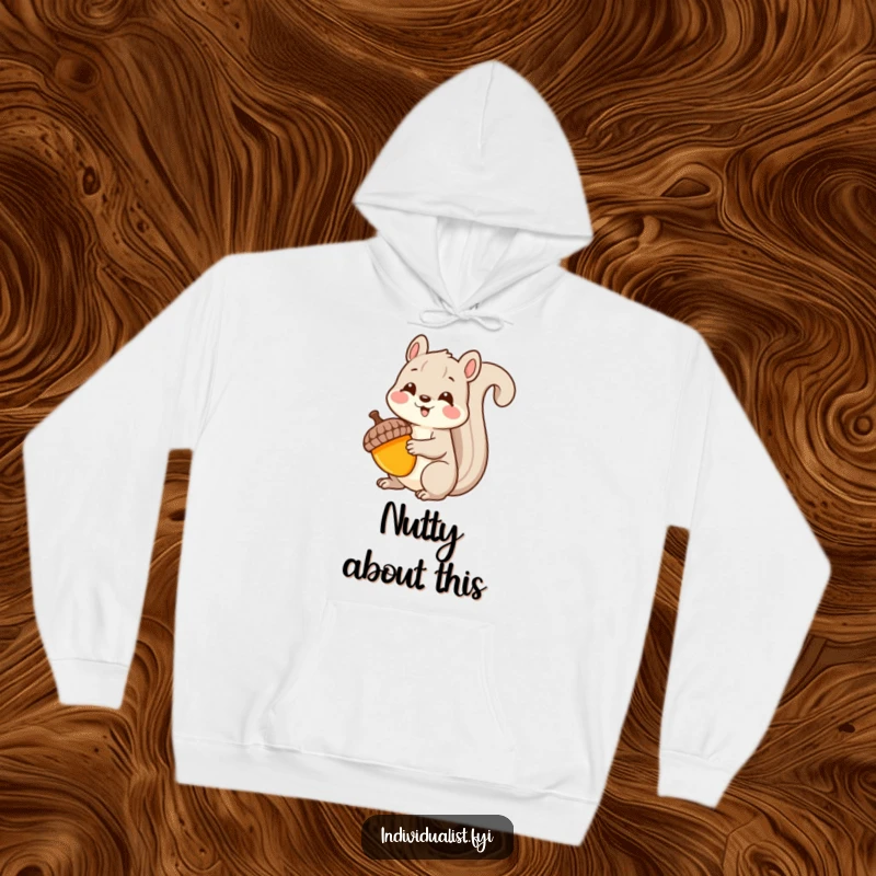 Funny Kawaii squirrel hoodie, depicting a delighted squirrel holding a brightly colored, uniquely shaped acorn, perfect for cozy wear.