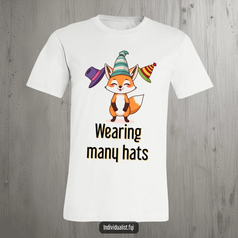 Funny t-shirt depicting a spirited fox juggling three different colored, eccentric hats, embodying joyfulness and unique style.
