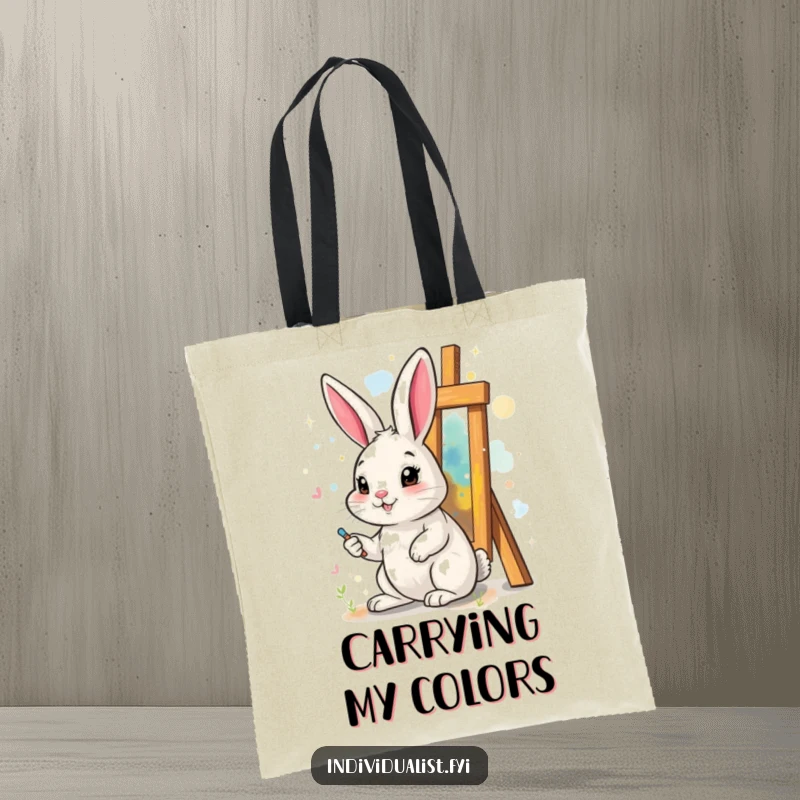 Funny tote bag featuring a cheerful rabbit painting a surreal, abstract artwork, ideal for artists and art lovers.